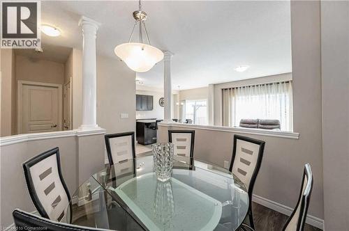 Dining space with ornate columns and hardwood / wood-style flooring - 243 Greenwater Place Unit# Upper, Kitchener, ON - Indoor Photo Showing Dining Room