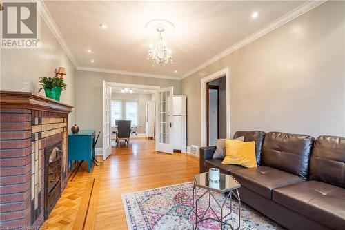 to Dining Room - 53 Tuxedo Avenue S, Hamilton, ON - Indoor Photo Showing Living Room With Fireplace