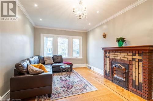 Hardwood Floors - 53 Tuxedo Avenue S, Hamilton, ON - Indoor Photo Showing Living Room With Fireplace