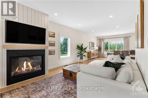 20379 Eigg Road, North Glengarry, ON - Indoor Photo Showing Living Room With Fireplace