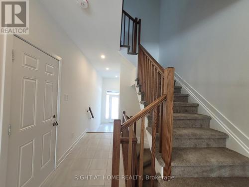 Modern railings & Staircase - 32 Overberg Way, Kanata (9010 - Kanata - Emerald Meadows/Trailwest), ON - Indoor Photo Showing Other Room