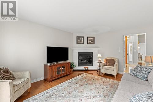 44 - 15 Lakeside Drive, St. Catharines (Port Weller), ON - Indoor Photo Showing Living Room With Fireplace