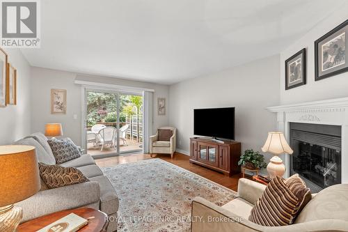 44 - 15 Lakeside Drive, St. Catharines (Port Weller), ON - Indoor Photo Showing Living Room With Fireplace