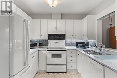 44 - 15 Lakeside Drive, St. Catharines (Port Weller), ON - Indoor Photo Showing Kitchen With Double Sink