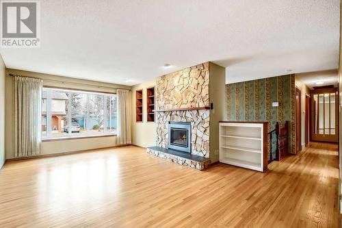 5131 Veronica Road Nw, Calgary, AB - Indoor Photo Showing Living Room With Fireplace