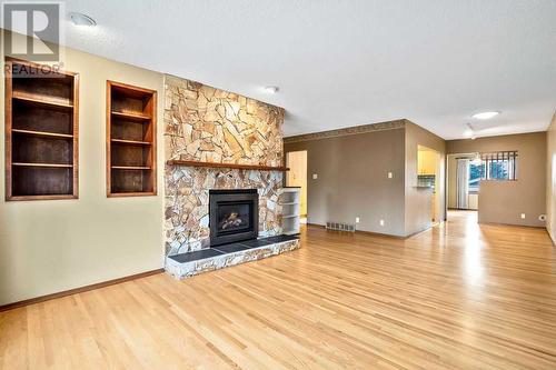 5131 Veronica Road Nw, Calgary, AB - Indoor Photo Showing Living Room With Fireplace