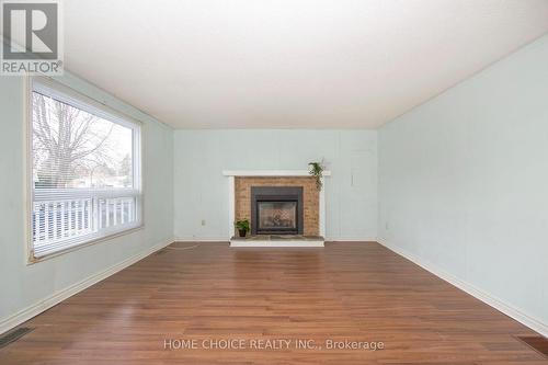 16 The Cove Road, Clarington, ON - Indoor Photo Showing Other Room With Fireplace