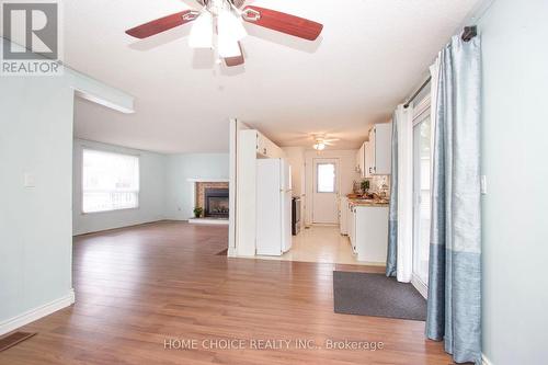 16 The Cove Road, Clarington, ON - Indoor Photo Showing Other Room With Fireplace