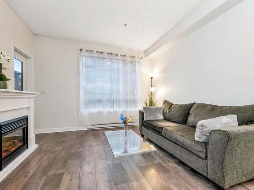 110-825 Goldstream Ave, Langford, BC - Indoor Photo Showing Living Room With Fireplace