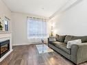 110-825 Goldstream Ave, Langford, BC  - Indoor Photo Showing Living Room With Fireplace 