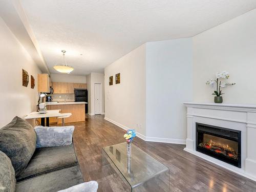 110-825 Goldstream Ave, Langford, BC - Indoor Photo Showing Living Room With Fireplace