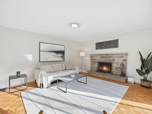 61 Fulbert Cres, Toronto, ON - Indoor Photo Showing Living Room With Fireplace