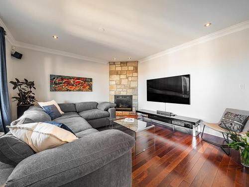 Salon - 443 Rue Hébert, Sainte-Julie, QC - Indoor Photo Showing Living Room With Fireplace