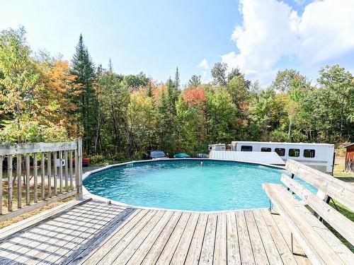 Pool - 136Z Rue Jimmy, Sainte-Sophie, QC - Outdoor With Above Ground Pool With Backyard