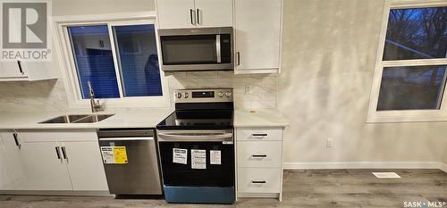 1149 K Avenue N, Saskatoon, SK - Indoor Photo Showing Kitchen With Double Sink