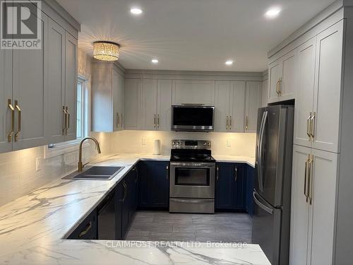 174 Jv Bonhomme Boulevard, Timmins (Tnw - Vic Heights), ON - Indoor Photo Showing Kitchen With Double Sink