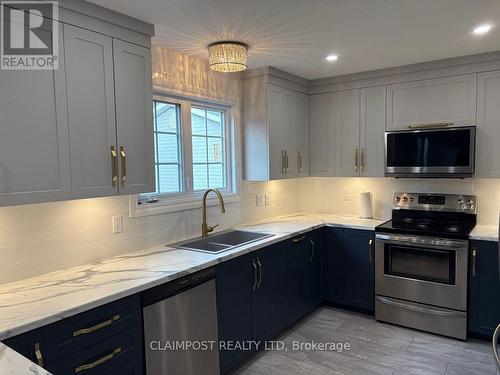 174 Jv Bonhomme Boulevard, Timmins (Tnw - Vic Heights), ON - Indoor Photo Showing Kitchen With Double Sink