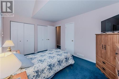 Carpeted bedroom with multiple closets - 435 Shadow Wood Crescent, Waterloo, ON - Indoor Photo Showing Bedroom