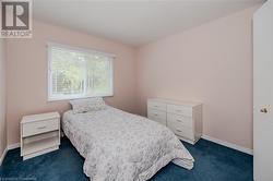 Bedroom featuring dark colored carpet - 