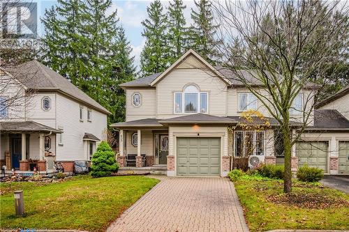 View of front facade with a porch and a front yard - 435 Shadow Wood Crescent, Waterloo, ON - Outdoor With Deck Patio Veranda With Facade