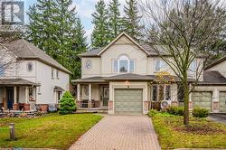 View of front facade with a porch and a front yard - 