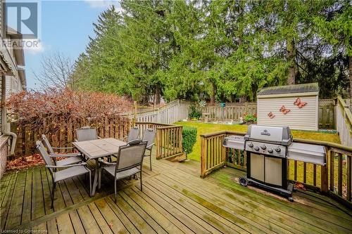 Wooden terrace featuring a storage unit and grilling area - 435 Shadow Wood Crescent, Waterloo, ON - Outdoor With Deck Patio Veranda