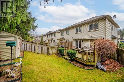 Back of house featuring a wooden deck, a yard, and a storage shed - 435 Shadow Wood Crescent, Waterloo, ON - Outdoor With Deck Patio Veranda With Exterior