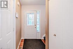 Doorway to outside with wood-type flooring - 