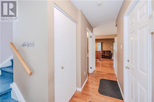 Hallway with vaulted ceiling, a textured ceiling, and light hardwood / wood-style flooring - 435 Shadow Wood Crescent, Waterloo, ON - Indoor Photo Showing Other Room