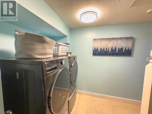 main laundry downstairs - 766 Favell Court, Kelowna, BC - Indoor Photo Showing Laundry Room