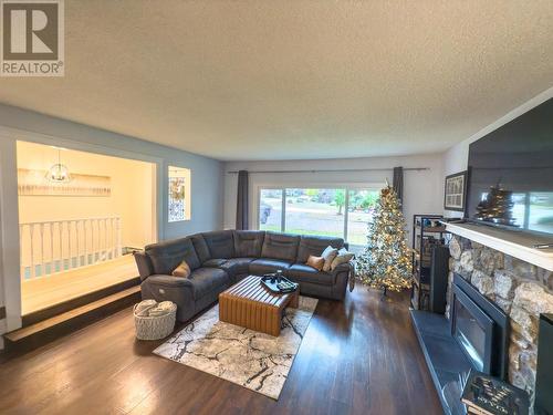 main living room - 766 Favell Court, Kelowna, BC - Indoor Photo Showing Living Room With Fireplace