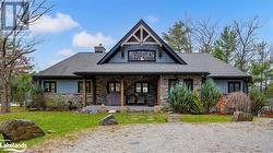 View of front of home featuring a front yard and a porch - 