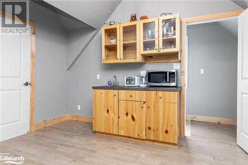 Kitchen with sink, light hardwood / wood-style floors, and vaulted ceiling - 3298 Seydel Lane Lane, Coldwater, ON - Indoor