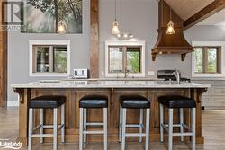 Kitchen with a kitchen breakfast bar and plenty of natural light - 