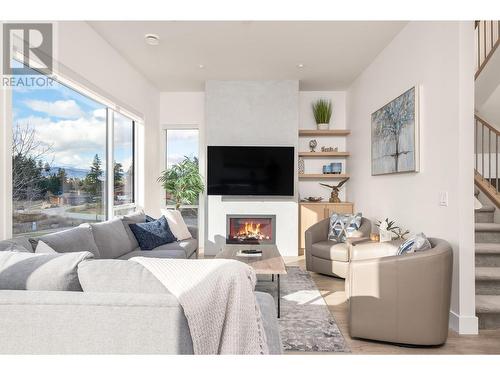 living room - 105 Predator Ridge Drive Unit# 3, Vernon, BC - Indoor Photo Showing Living Room With Fireplace