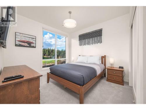 bedroom 2 upper level - 105 Predator Ridge Drive Unit# 3, Vernon, BC - Indoor Photo Showing Bedroom