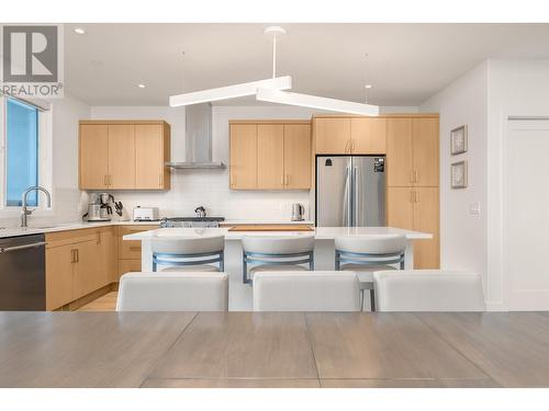 kitchen view from dining table - 105 Predator Ridge Drive Unit# 3, Vernon, BC - Indoor Photo Showing Kitchen With Upgraded Kitchen