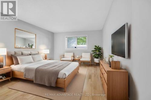 Virtually Staged Primary Bedroom - 1 - 515 Proudfoot Lane, London, ON - Indoor Photo Showing Bedroom