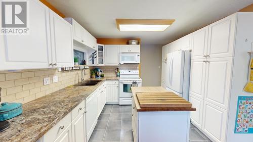 8711 88 Street, Fort St. John, BC - Indoor Photo Showing Kitchen With Double Sink