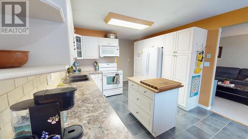 8711 88 Street, Fort St. John, BC - Indoor Photo Showing Kitchen With Double Sink