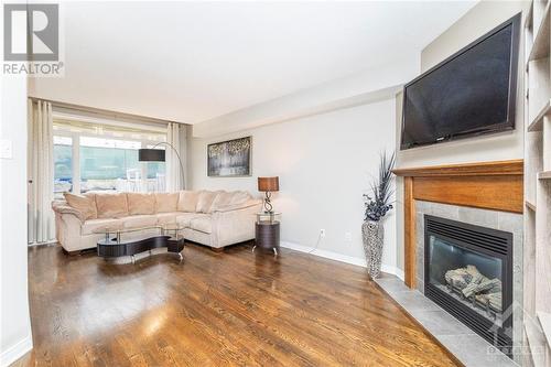 155 Challenge Crescent, Orleans, ON - Indoor Photo Showing Living Room With Fireplace