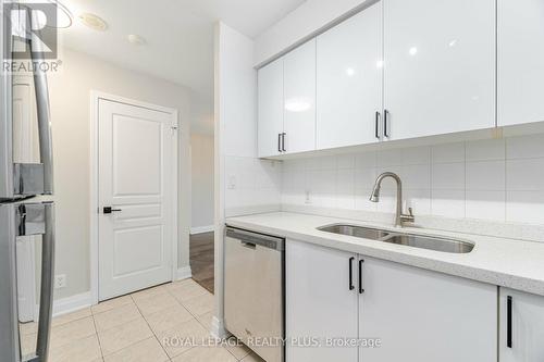 304 - 4879 Kimbermount Avenue, Mississauga, ON - Indoor Photo Showing Kitchen With Double Sink