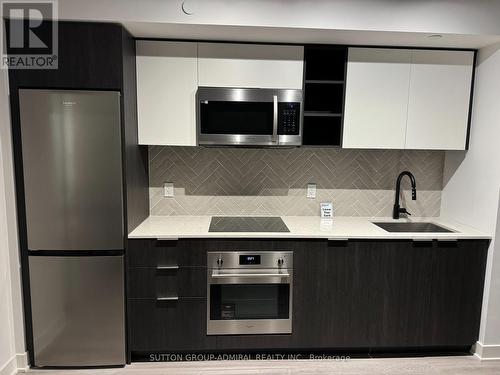 419 - 36 Zorra Street N, Toronto, ON - Indoor Photo Showing Kitchen With Upgraded Kitchen