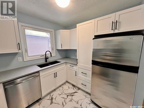 211 Broad Street, Regina, SK - Indoor Photo Showing Kitchen With Double Sink