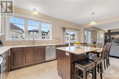 Bright Kitchen with Windows at the sink overlooking Huge Backyard and Sit Up Island - 379 Andalusian Crescent, Kanata (9010 - Kanata - Emerald Meadows/Trailwest), ON - Indoor