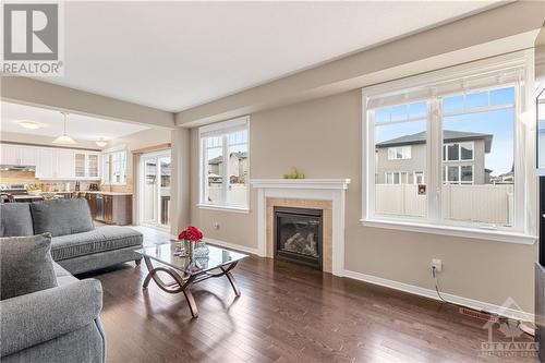 Large Great Room with Open Concept to the Kitchen - 379 Andalusian Crescent, Kanata (9010 - Kanata - Emerald Meadows/Trailwest), ON - Indoor Photo Showing Living Room With Fireplace