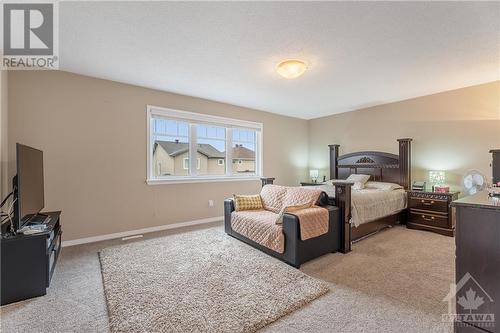 Substantial Primary Bedroom with Double Doors & 2 Walk In Closets! - 379 Andalusian Crescent, Kanata (9010 - Kanata - Emerald Meadows/Trailwest), ON - Indoor Photo Showing Bedroom