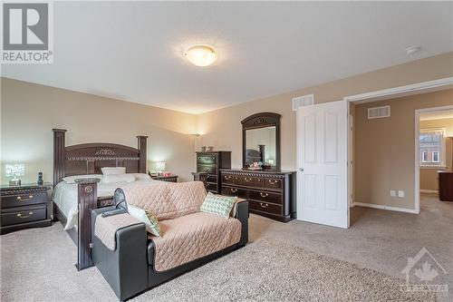 Large Primary Bedroom with Double Doors & 2 Walk In Closets! - 379 Andalusian Crescent, Kanata (9010 - Kanata - Emerald Meadows/Trailwest), ON - Indoor Photo Showing Bedroom