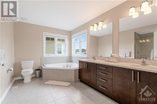 Roomy Primary Bedroom Ensuite with Soaker Tub, Double Sink, Glass Shower - 379 Andalusian Crescent, Kanata (9010 - Kanata - Emerald Meadows/Trailwest), ON - Indoor Photo Showing Bathroom