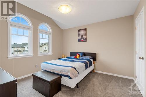 4th Generous Sized Bedroom with Vaulted Ceilings - 379 Andalusian Crescent, Kanata (9010 - Kanata - Emerald Meadows/Trailwest), ON - Indoor Photo Showing Bedroom